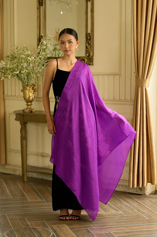 Model holding open a deep purple hand-dyed mulberry silk scarf over a black velvet dress