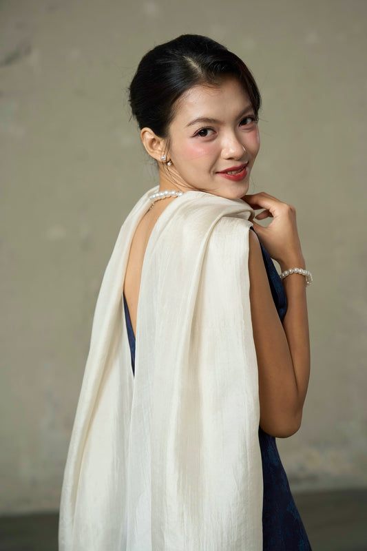Oyster silk scarf draped over the shoulder — hand-dyed mulberry silk by Silk & Bears