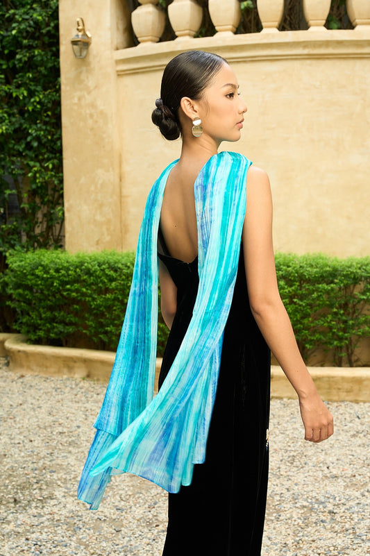 Back view of the sky blue brushstroke silk scarf draped down the back
