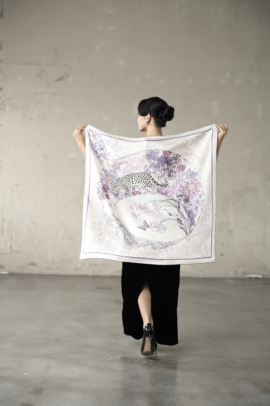 Lilac and violet leopard silk twill scarf held open to show the full 90x90cm printed design