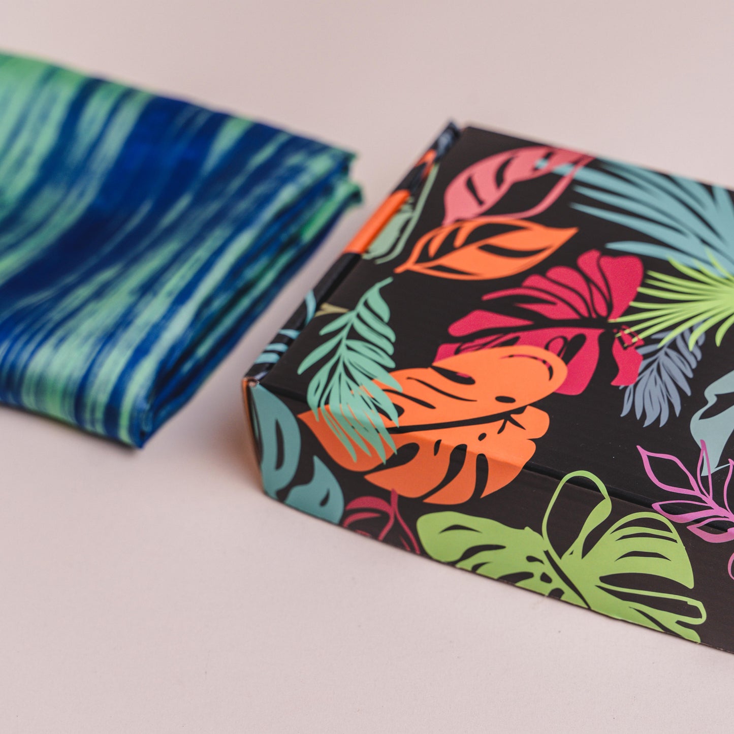 hand-dyed silk scarf displayed against artistic backdrop — Silk & Bears