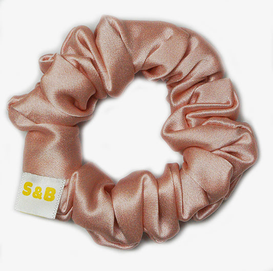 Medium mixed-colour silk scrunchies worn in the hair