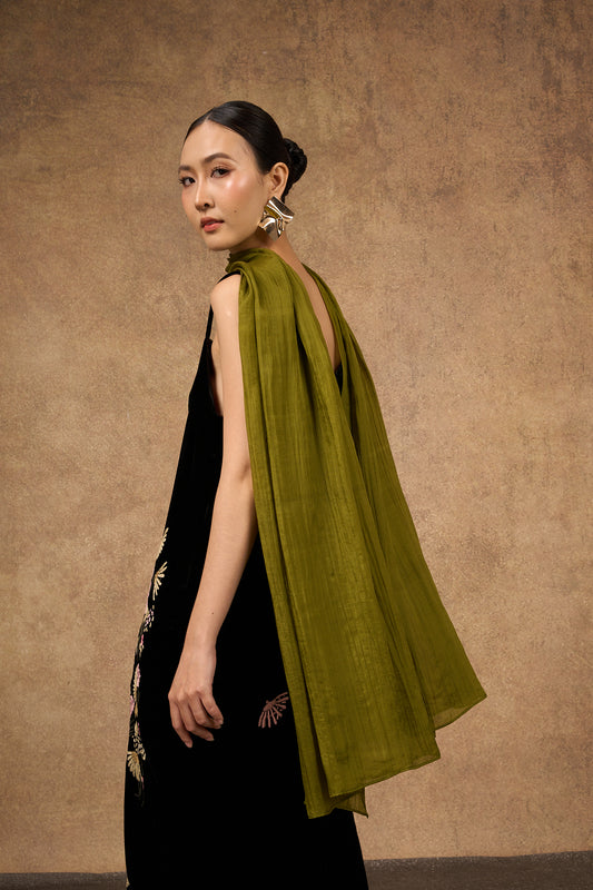 Model wearing an olive green hand-dyed silk scarf draped over the shoulders