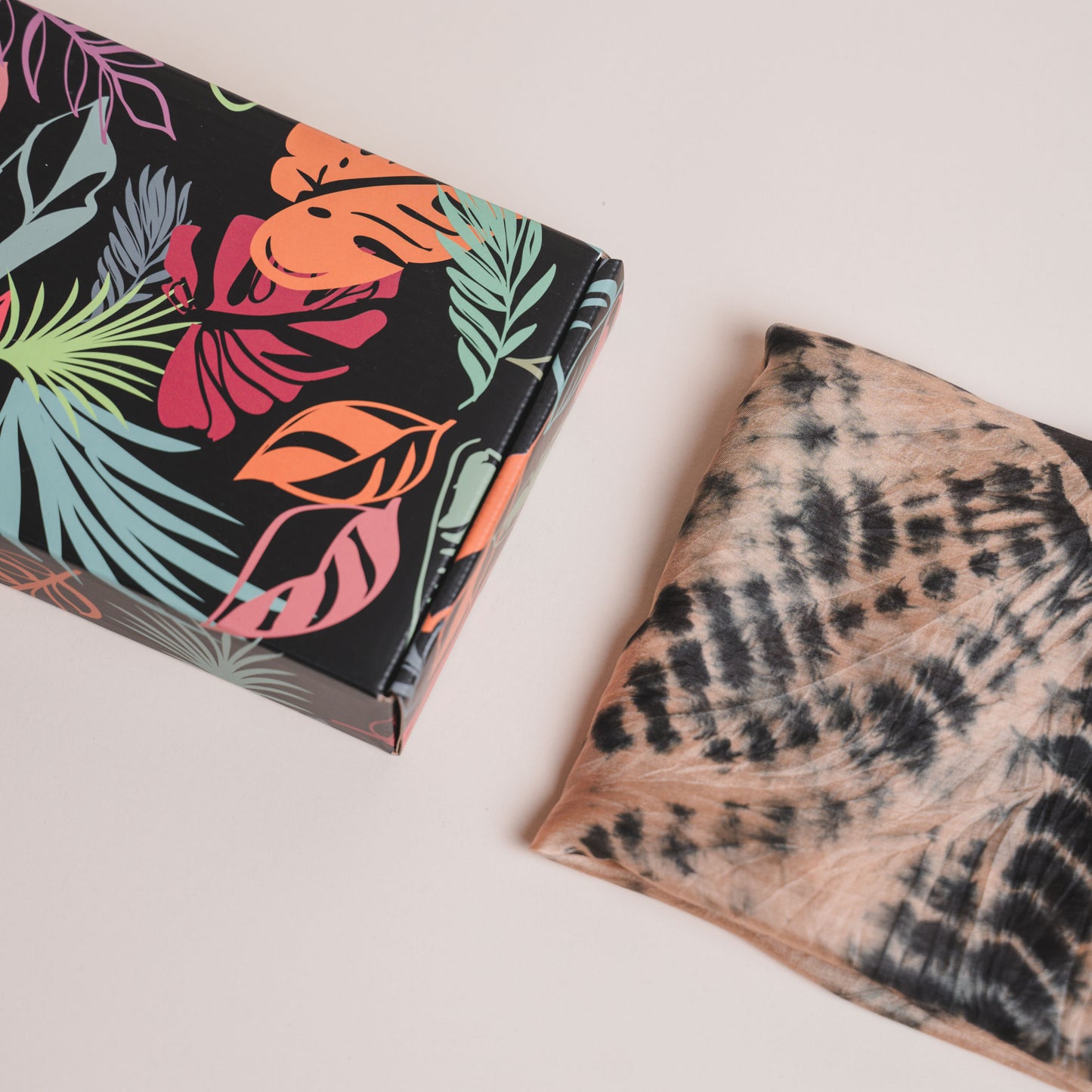 Copper and black shibori hand-dyed mulberry silk scarf styled flat, a luxury gift