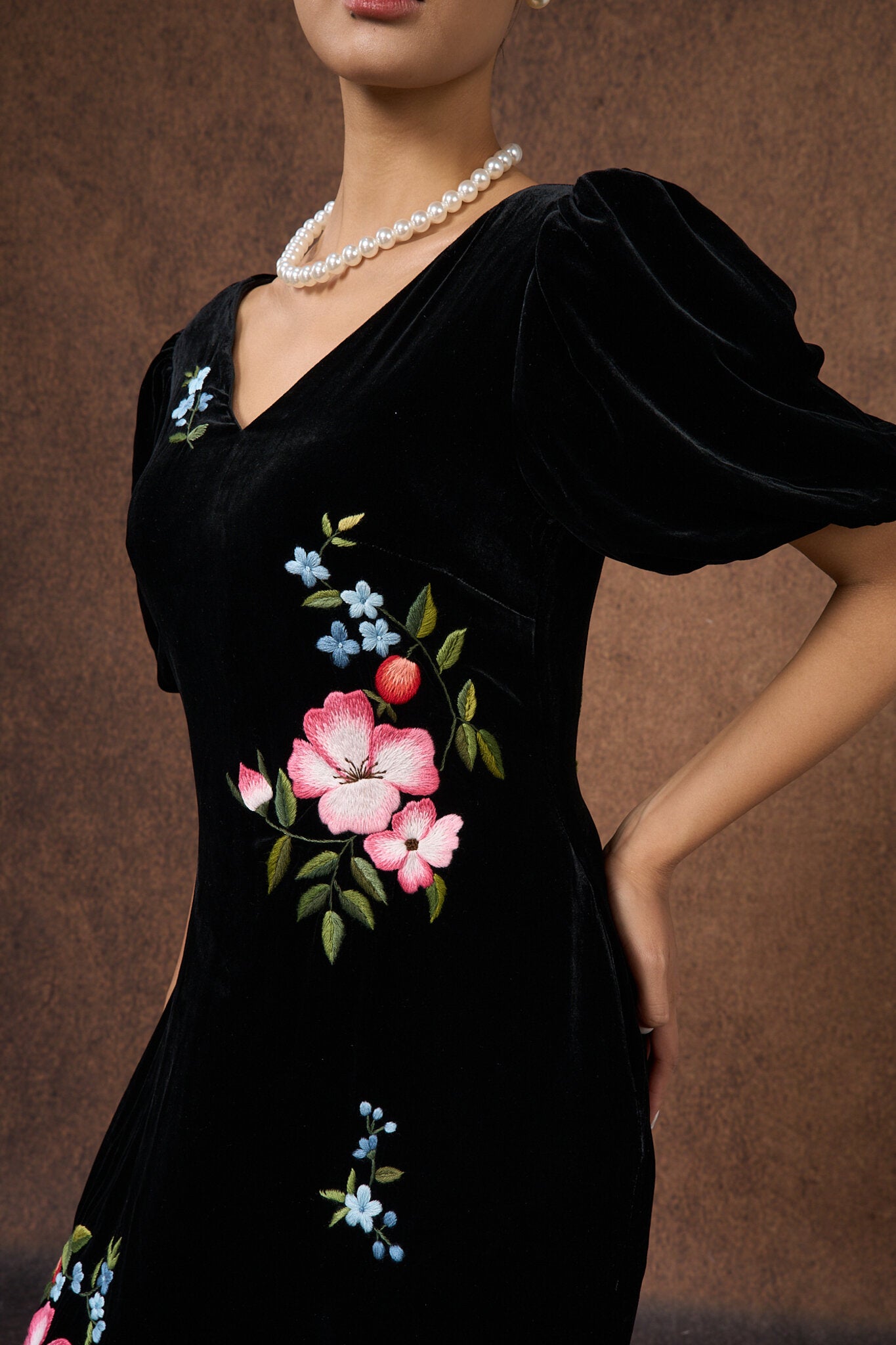 Editorial three-quarter view of the black floral silk velvet dress