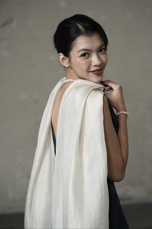 Oyster silk scarf draped over the shoulder — hand-dyed mulberry silk by Silk & Bears