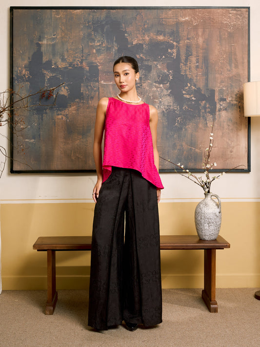 Model wearing the Ophelia black wide-leg silk palazzo trousers