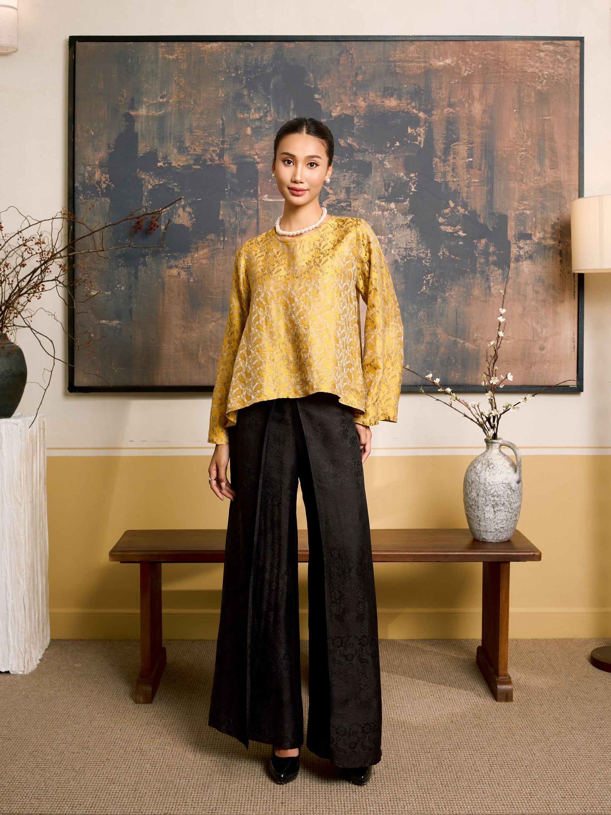 Model wearing the Ophelia golden eclipse draped silk tunic blouse