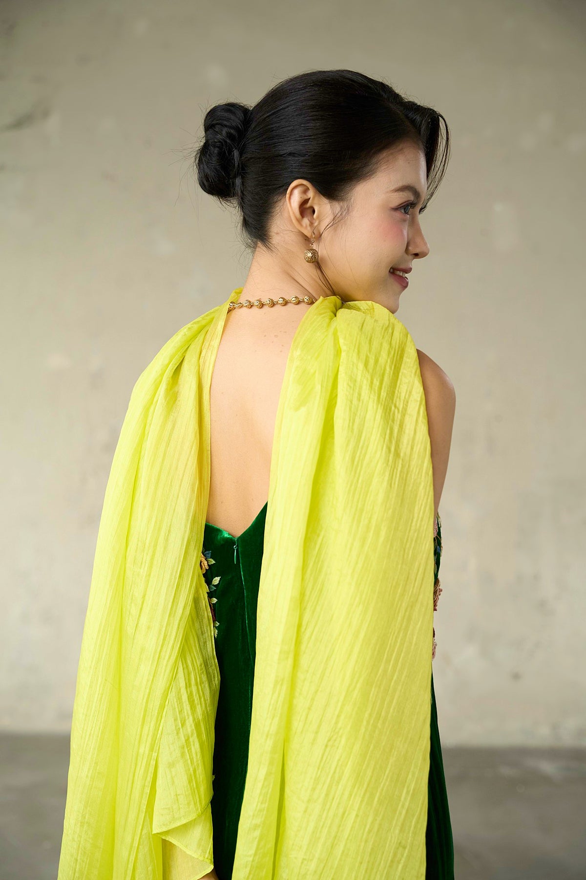 Close view of the citrine silk scarf showing the fine lengthways crinkle and hand-dyed sheen