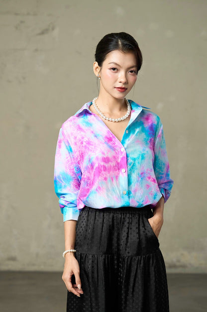 Fuchsia and turquoise tie-dye habotai silk shirt worn open at the neck with pearls