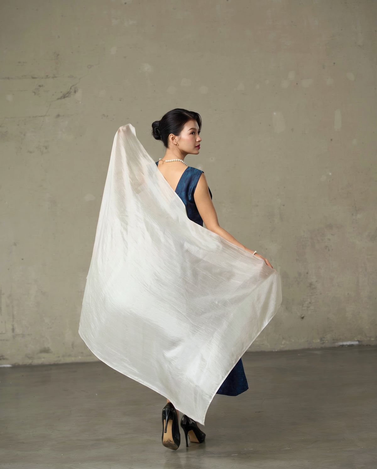 Oyster silk scarf held open to show the full 85 x 180 cm length and its soft pearl sheen