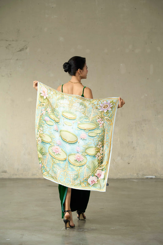 Waterlily House printed silk twill scarf held open to show the full aqua, green and gold glasshouse print