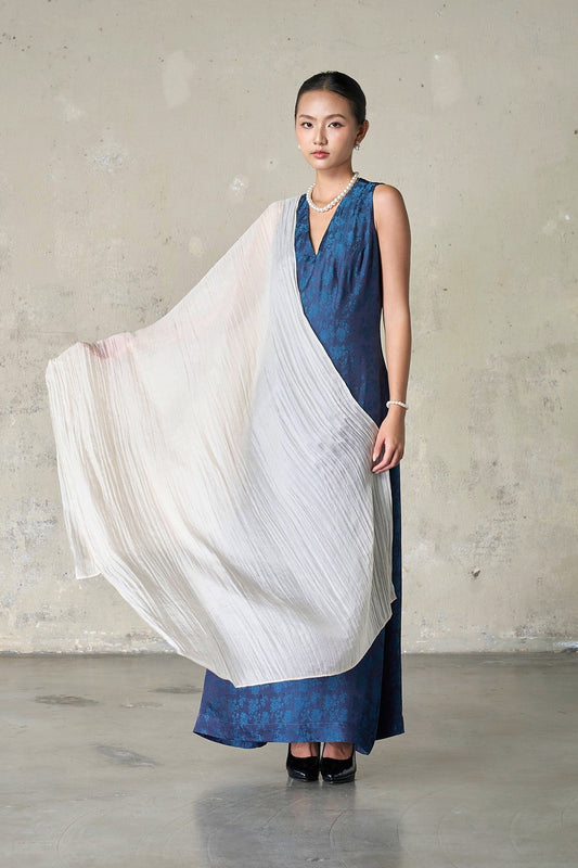 Champagne silk scarf held open at the side to show the full 85 x 180 cm length and semi-sheer weave