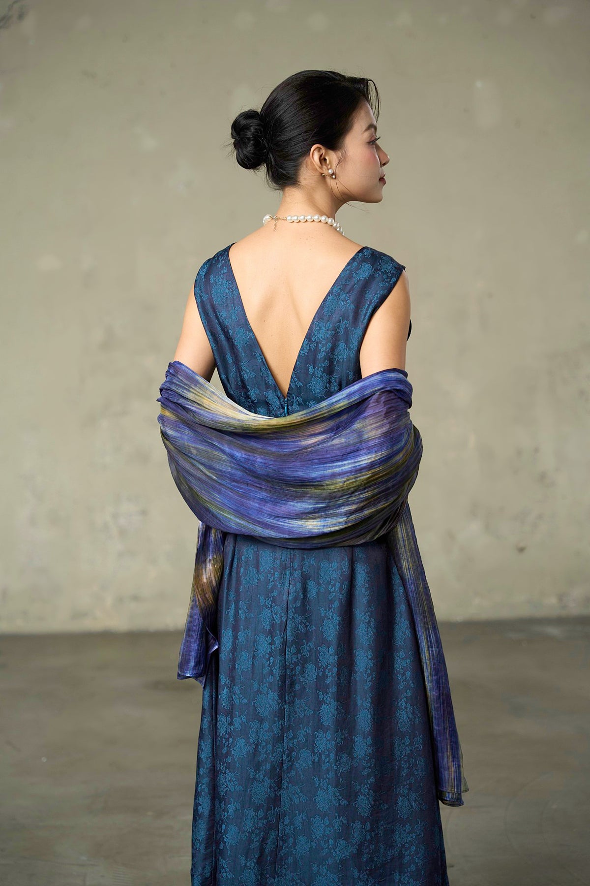 Iris Field banded silk scarf worn as a shoulder wrap