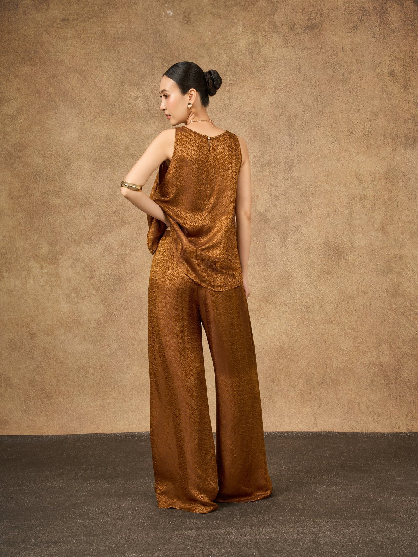 Side view of the Ophelia bronze gold wide-leg silk palazzo trousers