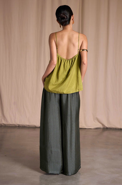 Back view of Portia Khaki Diamond silk wide-leg trousers with elasticated back waist and an olive silk camisole