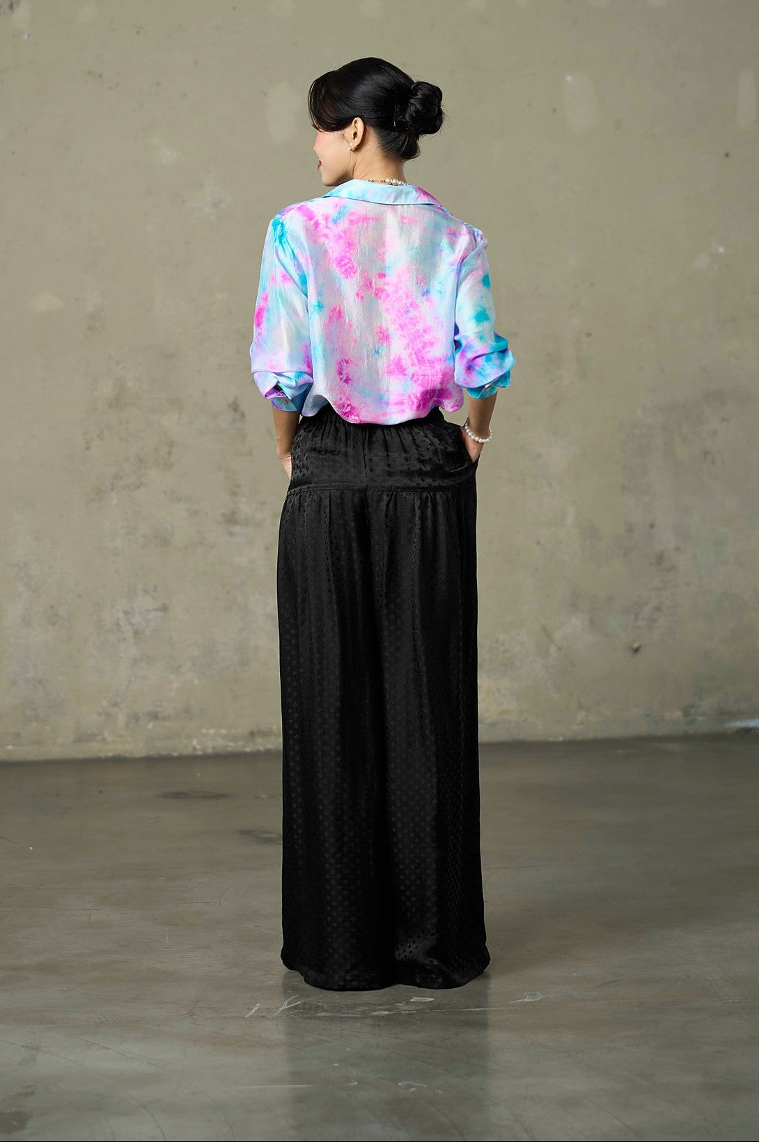Back view of the Lagoon Bloom tie-dyed habotai silk shirt with curved shirt-tail hem