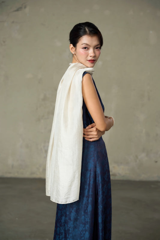 Back view of the oyster silk scarf worn as a shoulder drape