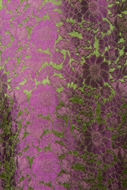 Fabric detail of magenta silk jacquard with an olive-green woven floral and leaf pattern