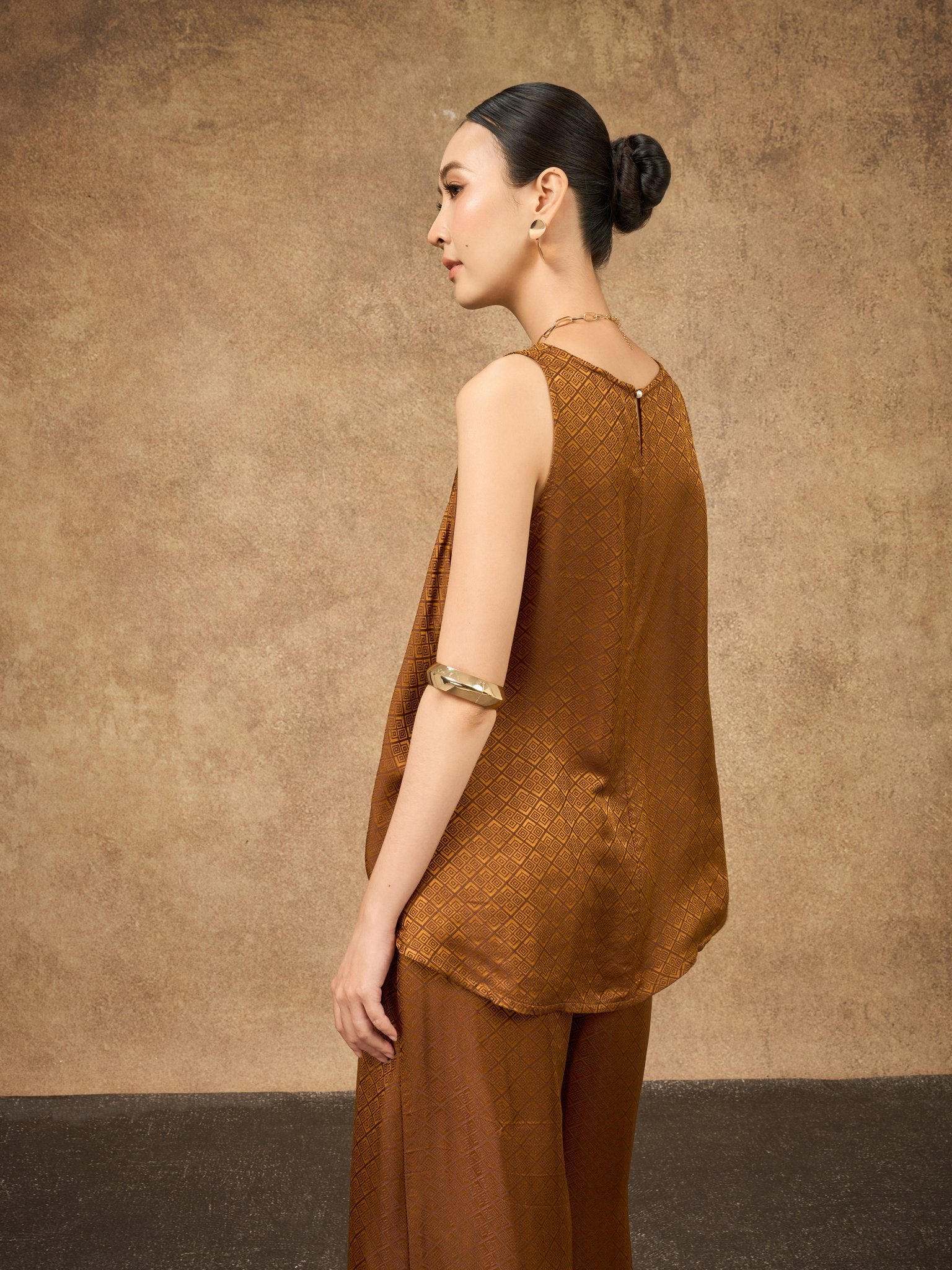 Back view of the Ophelia bronze gold draped silk shell top