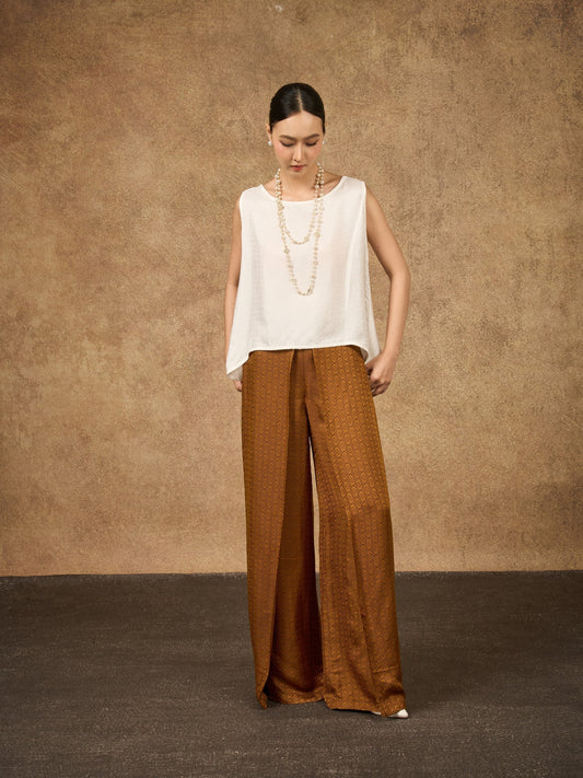 Model wearing the Ophelia bronze gold wide-leg silk palazzo trousers