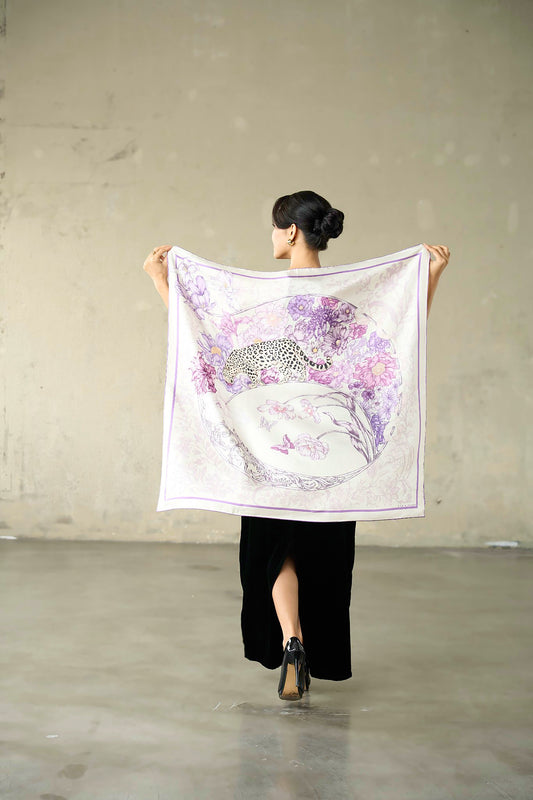 Lilac and violet leopard silk twill scarf held open to show the full 90x90cm printed design