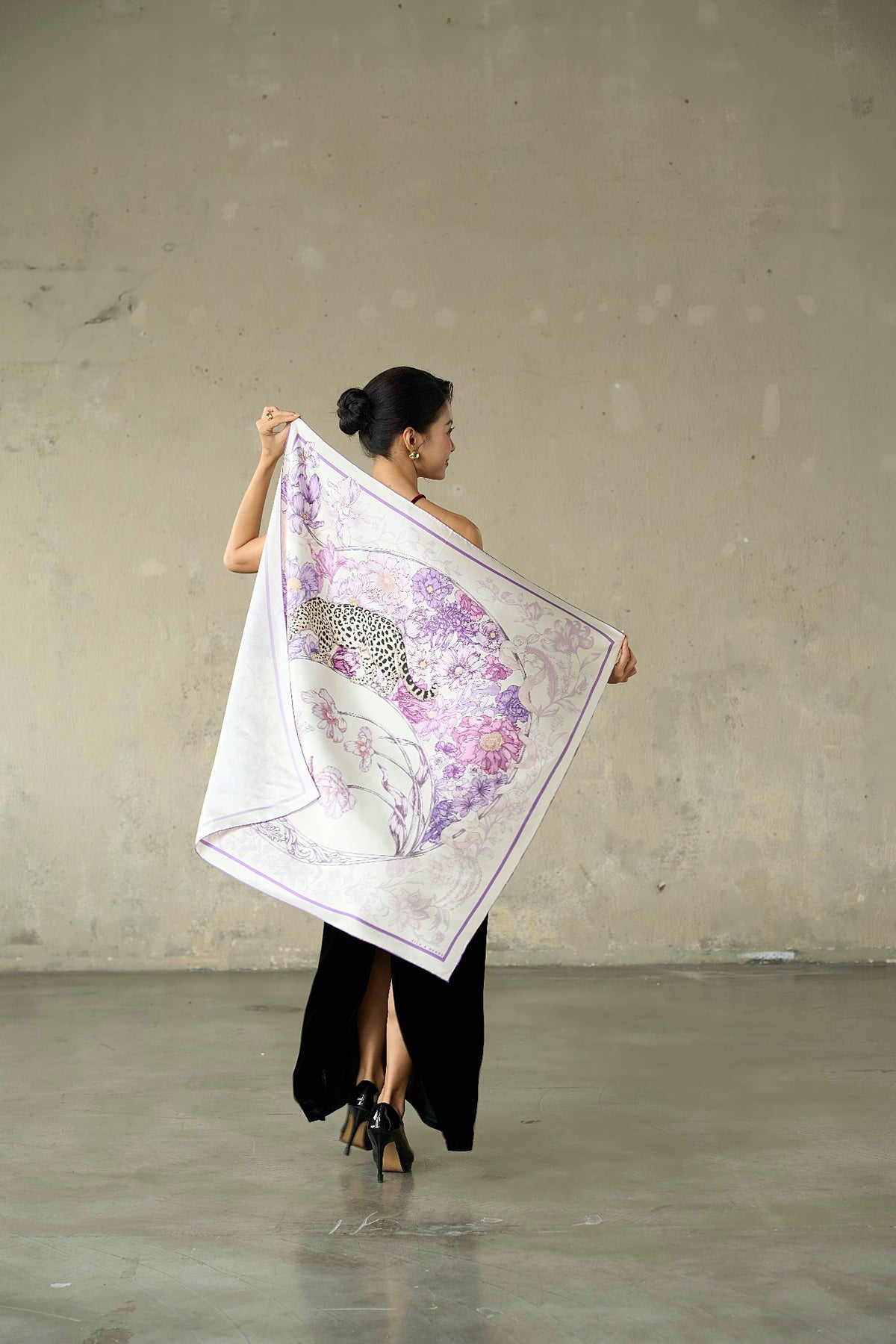 Lilac and violet leopard silk scarf draped diagonally, showing the print in movement