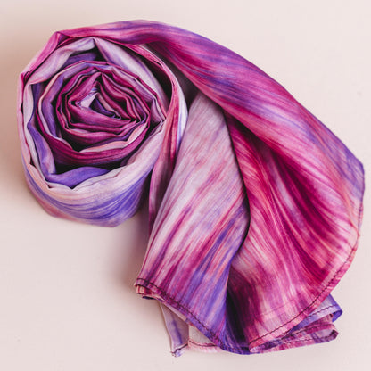 Detail of the purple and pink brushstroke silk scarf, hand-dyed on mulberry silk