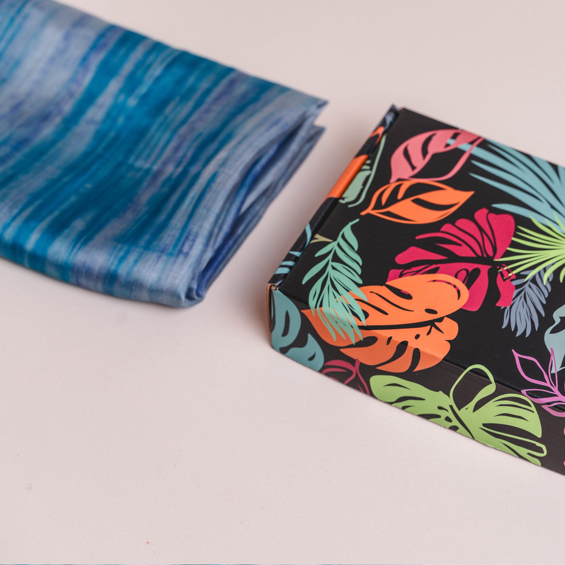Sky blue brushstroke hand-dyed mulberry silk scarf styled flat, a luxury gift