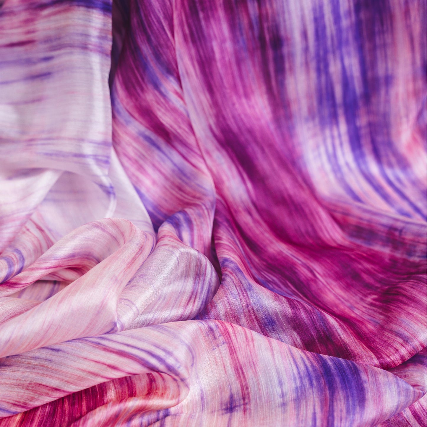Purple and pink brushstroke hand-dyed silk scarf styled flat, a luxury silk gift