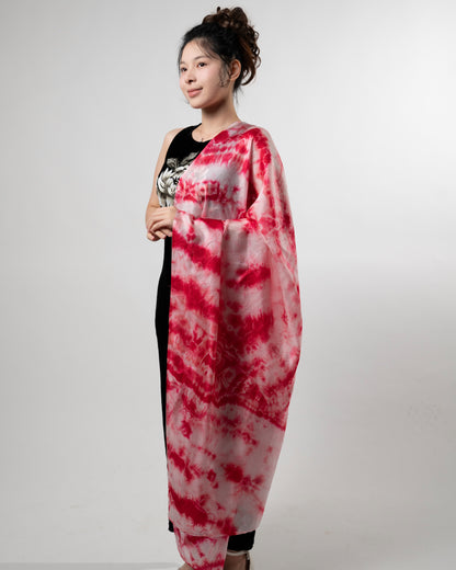 Detail of the crimson red shibori silk scarf, hand-dyed on mulberry silk