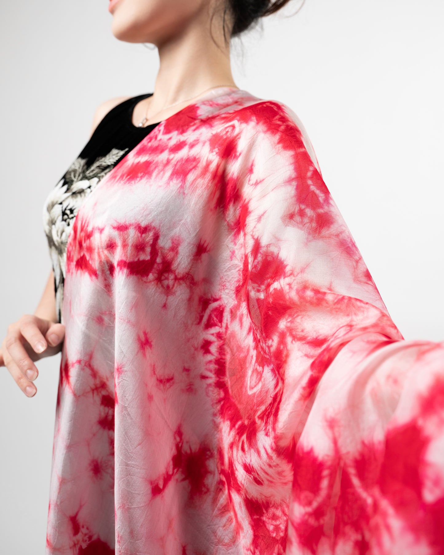 Crimson red shibori hand-dyed mulberry silk scarf styled flat, a luxury gift