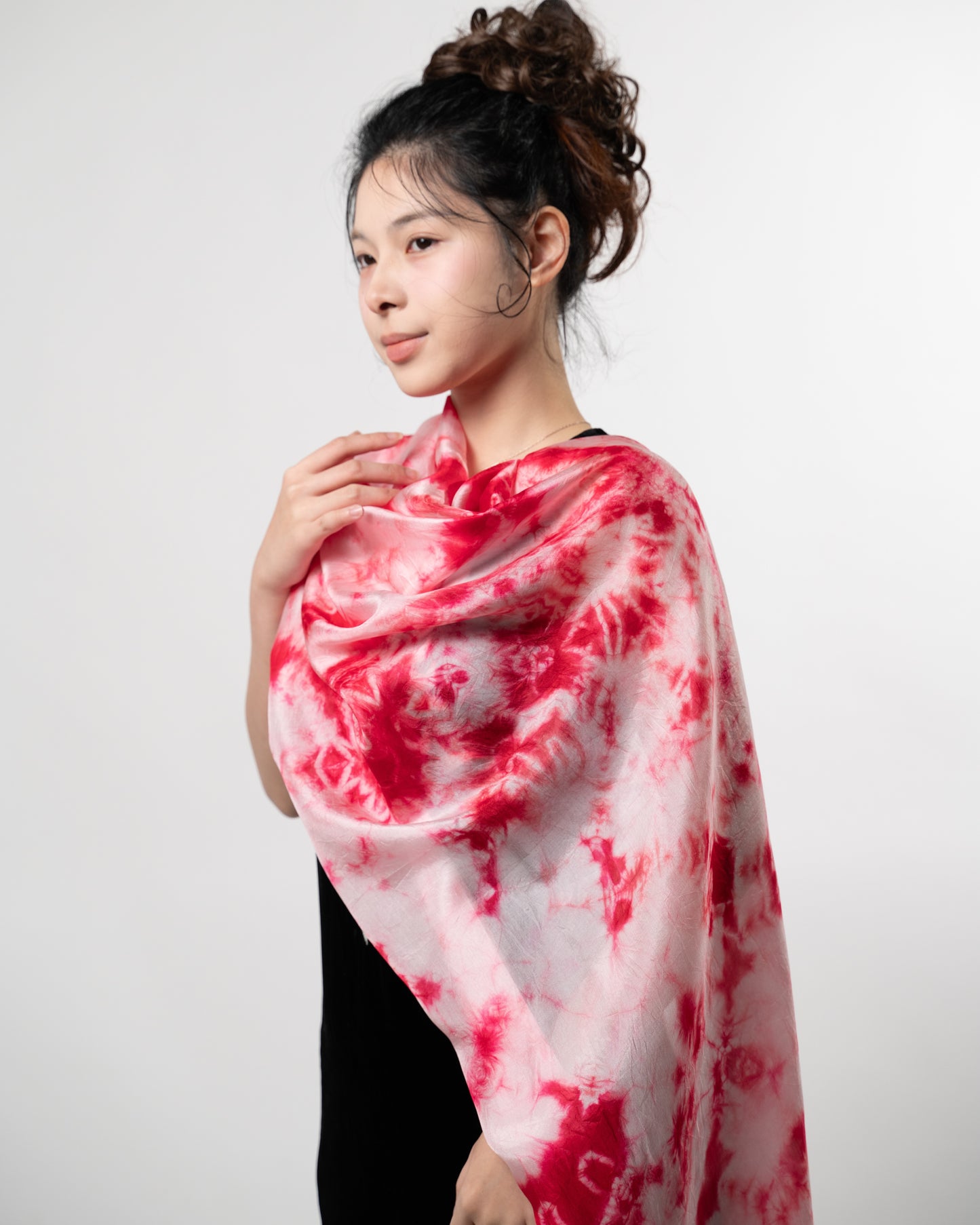 Crimson red shibori silk scarf styled for a special occasion by Silk & Bears