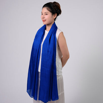 Back view of a model wearing the royal blue silk shawl by Silk & Bears