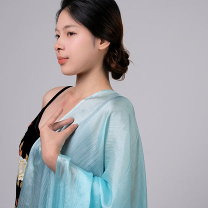 Back view of a model wearing the ice blue silk shawl by Silk & Bears