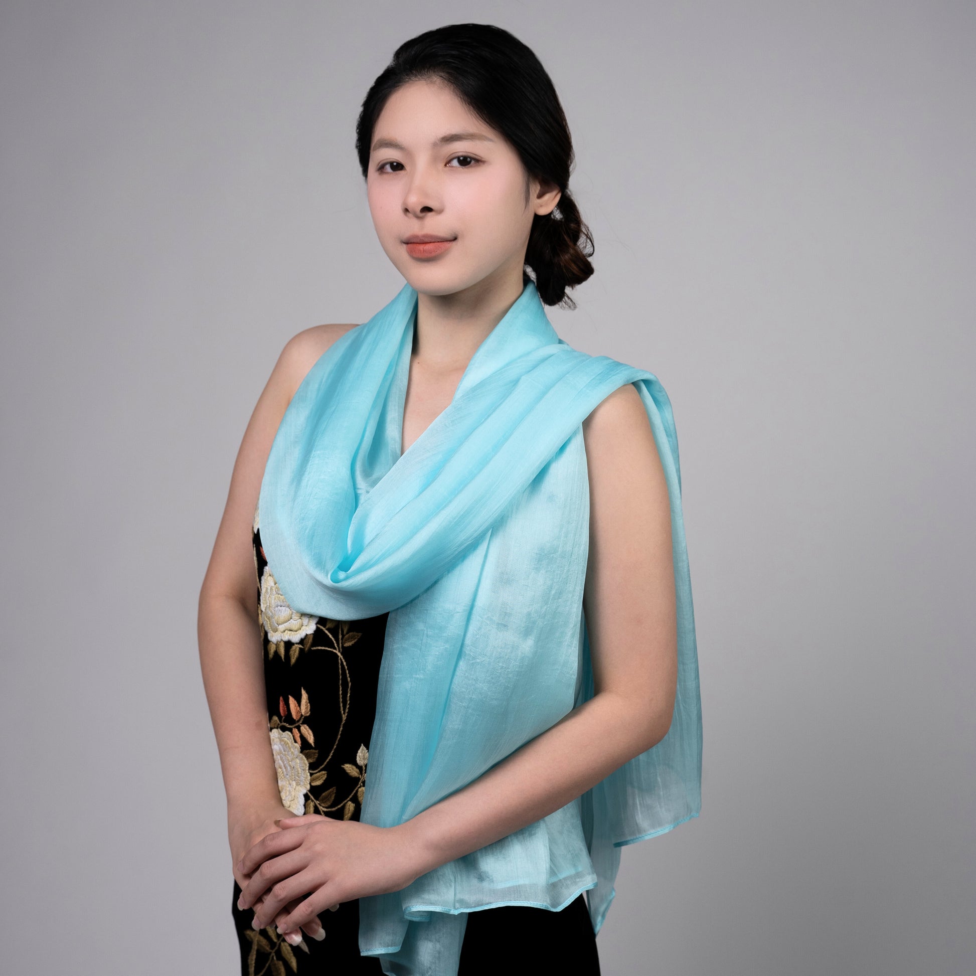 Ice blue hand-dyed mulberry silk scarf styled flat, a luxury silk gift