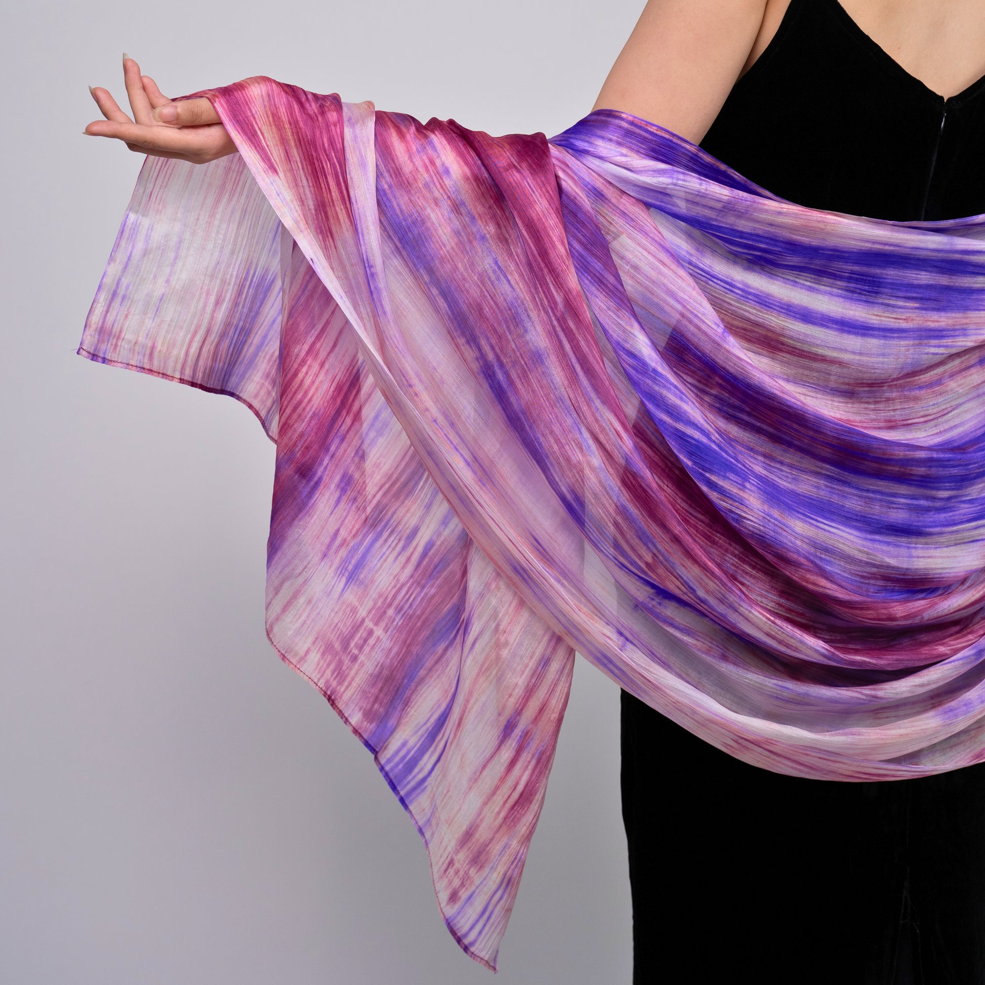 Purple and pink brushstroke silk scarf worn as a flowing shawl, hand-dyed mulberry silk