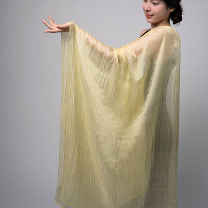 Back view of a model wearing the golden yellow silk shawl by Silk & Bears