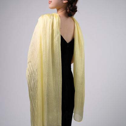 Golden yellow silk scarf worn as a flowing shawl, hand-dyed mulberry silk