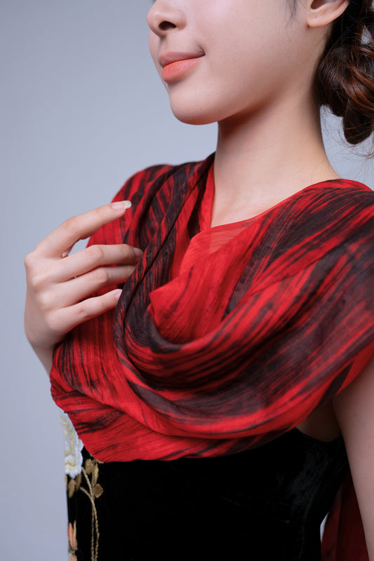 Red and black brushstroke silk scarf worn as a flowing shawl, hand-dyed mulberry silk