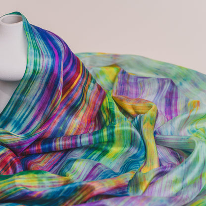 Back view of a model wearing the rainbow brushstroke silk shawl by Silk & Bears