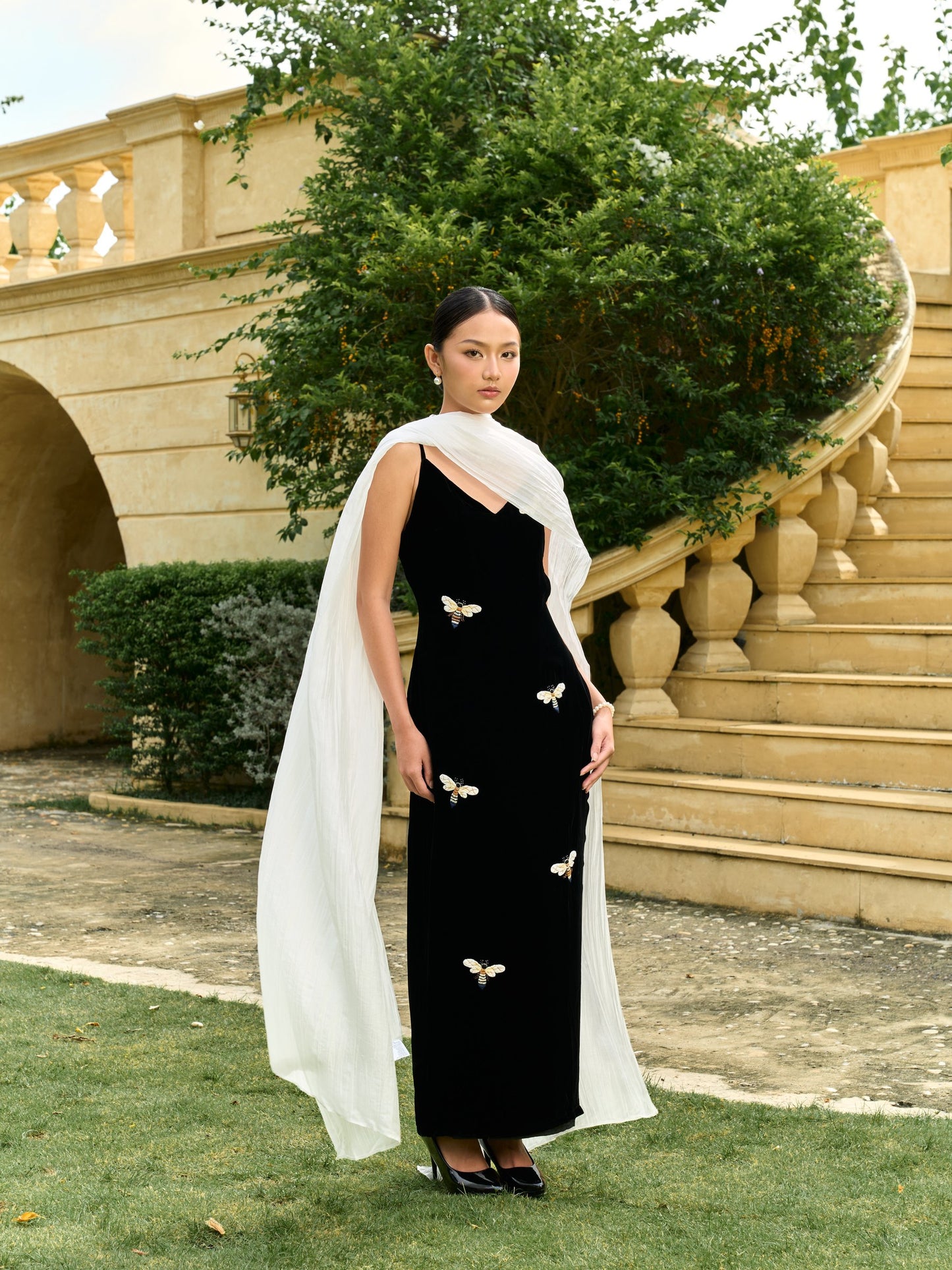 Pearl white silk shawl worn as a one-shoulder evening wrap — hand-dyed mulberry silk bridal cape