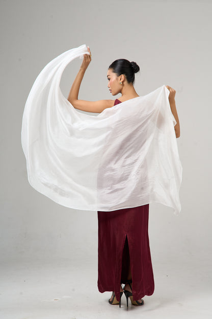 Model wearing a pearl white hand-dyed silk scarf draped over the shoulders
