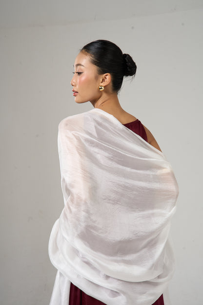 Pearl white mulberry silk scarf styled loosely around the neck, a lightweight wrap