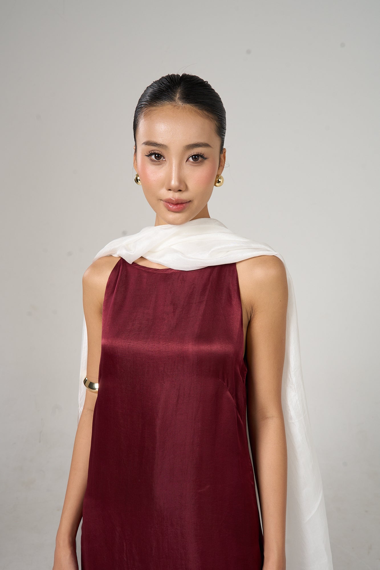 Pearl white silk scarf held open to show the full soft colour