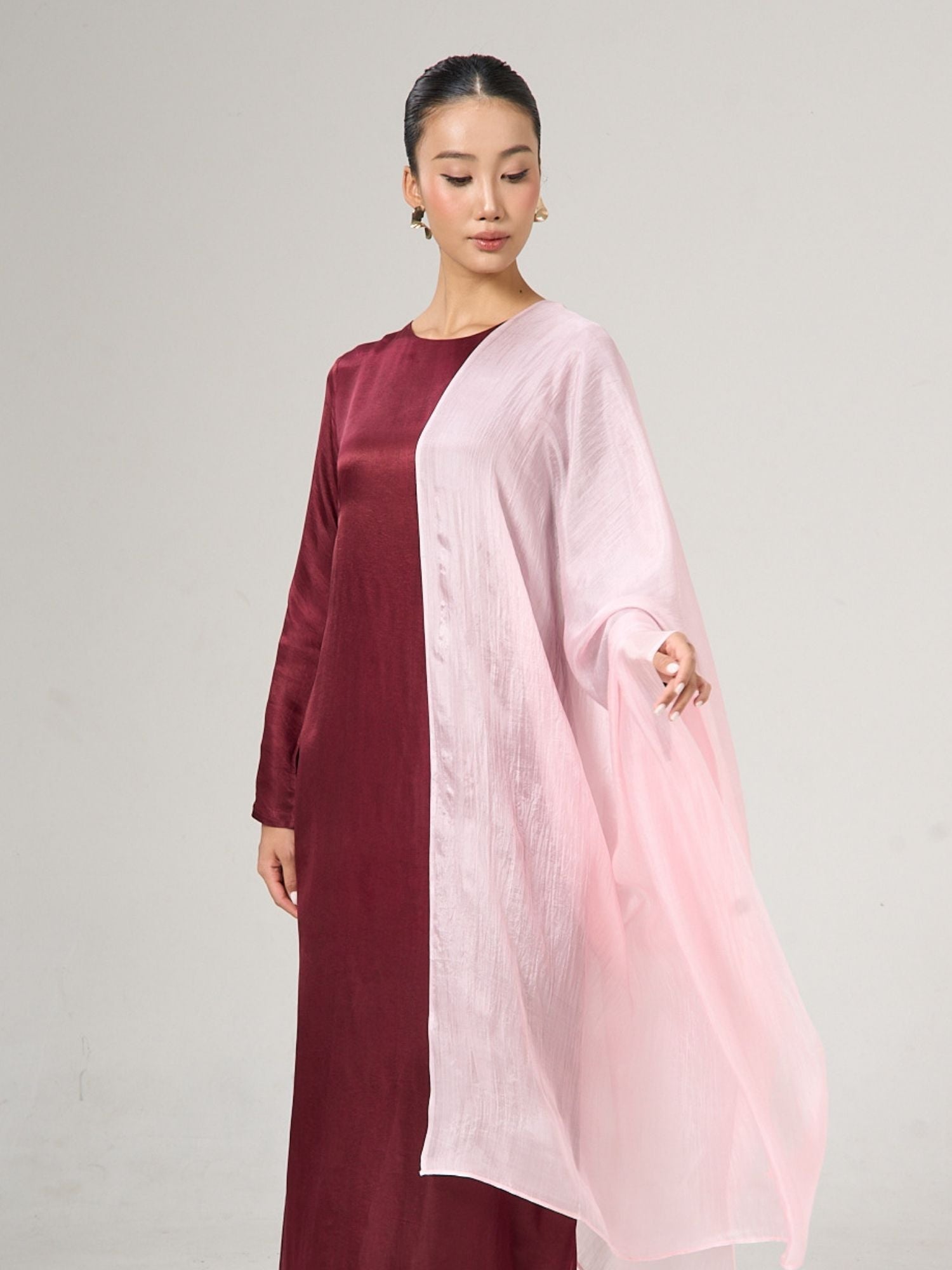 Blush pink hand-dyed mulberry silk shawl worn over the shoulders, lifestyle portrait