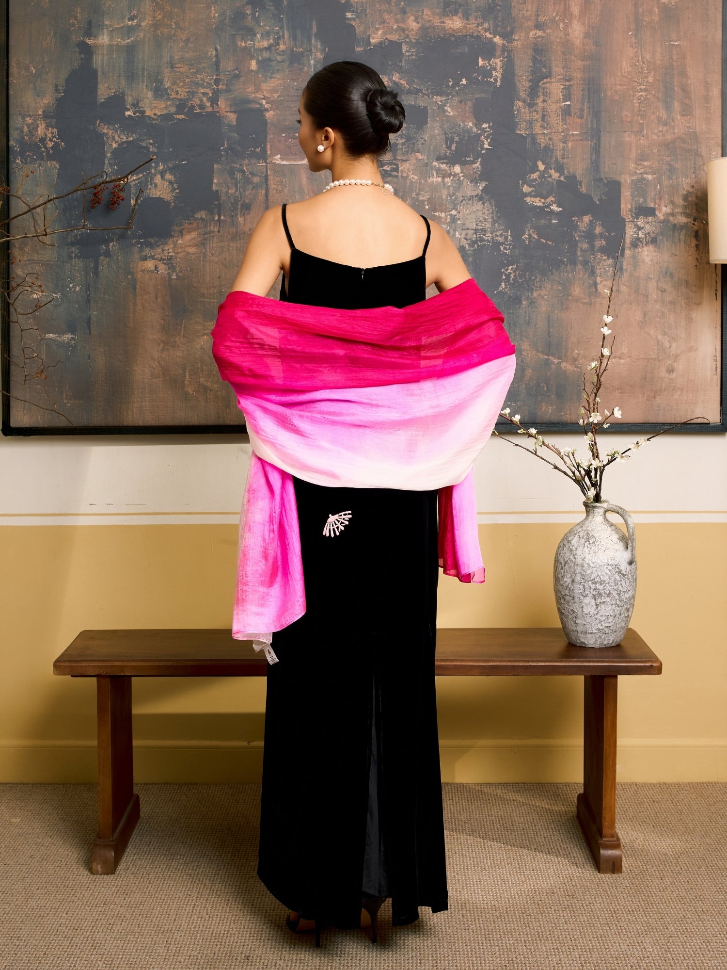 Close-up of the hot pink ombre silk scarf, showing the graduated colour