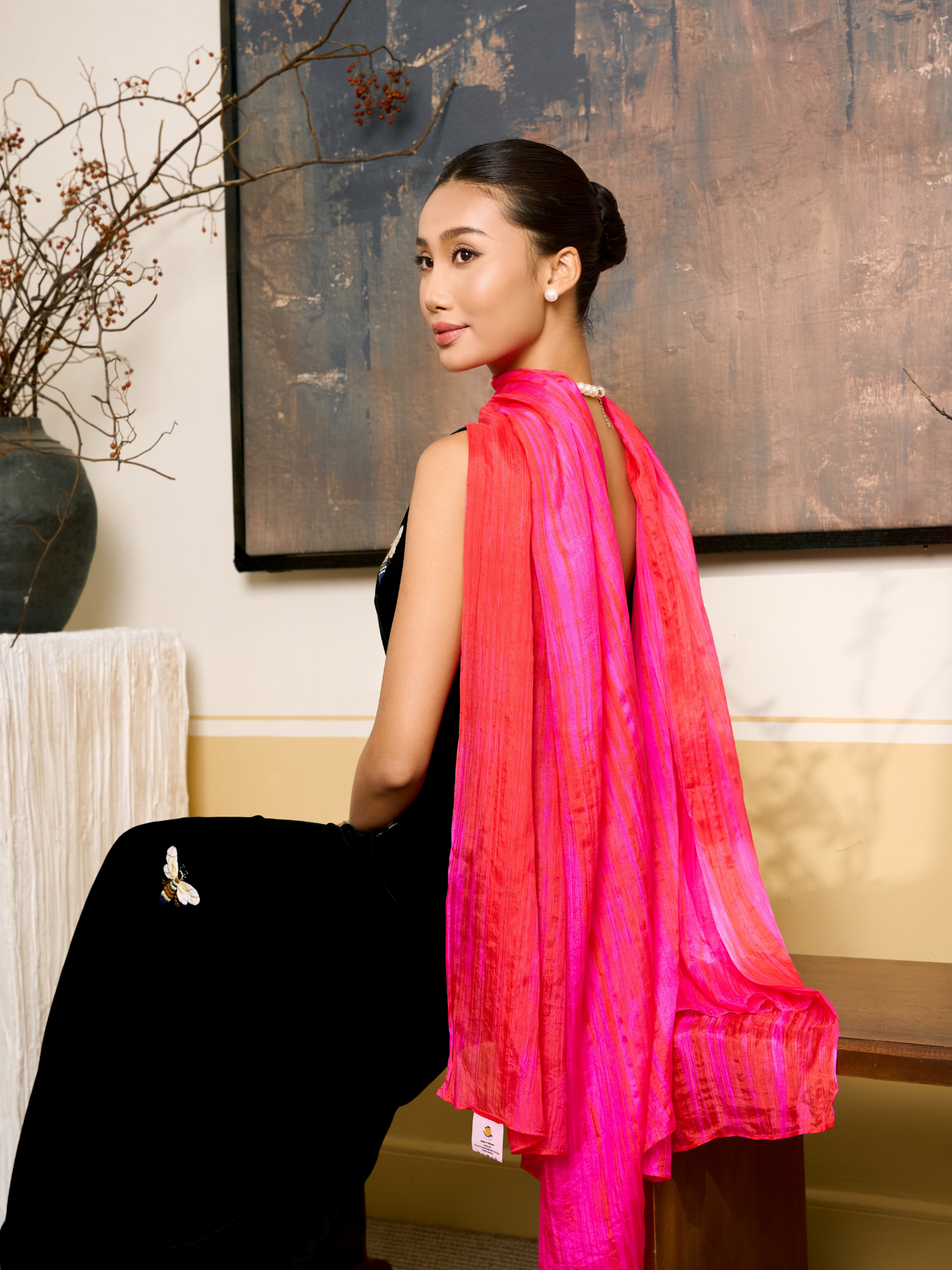 Hot pink brushstroke mulberry silk scarf styled loosely around the neck