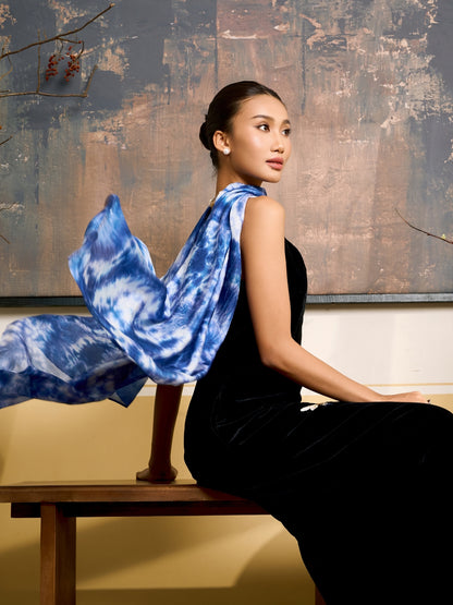 Indigo blue shibori mulberry silk scarf styled loosely around the neck