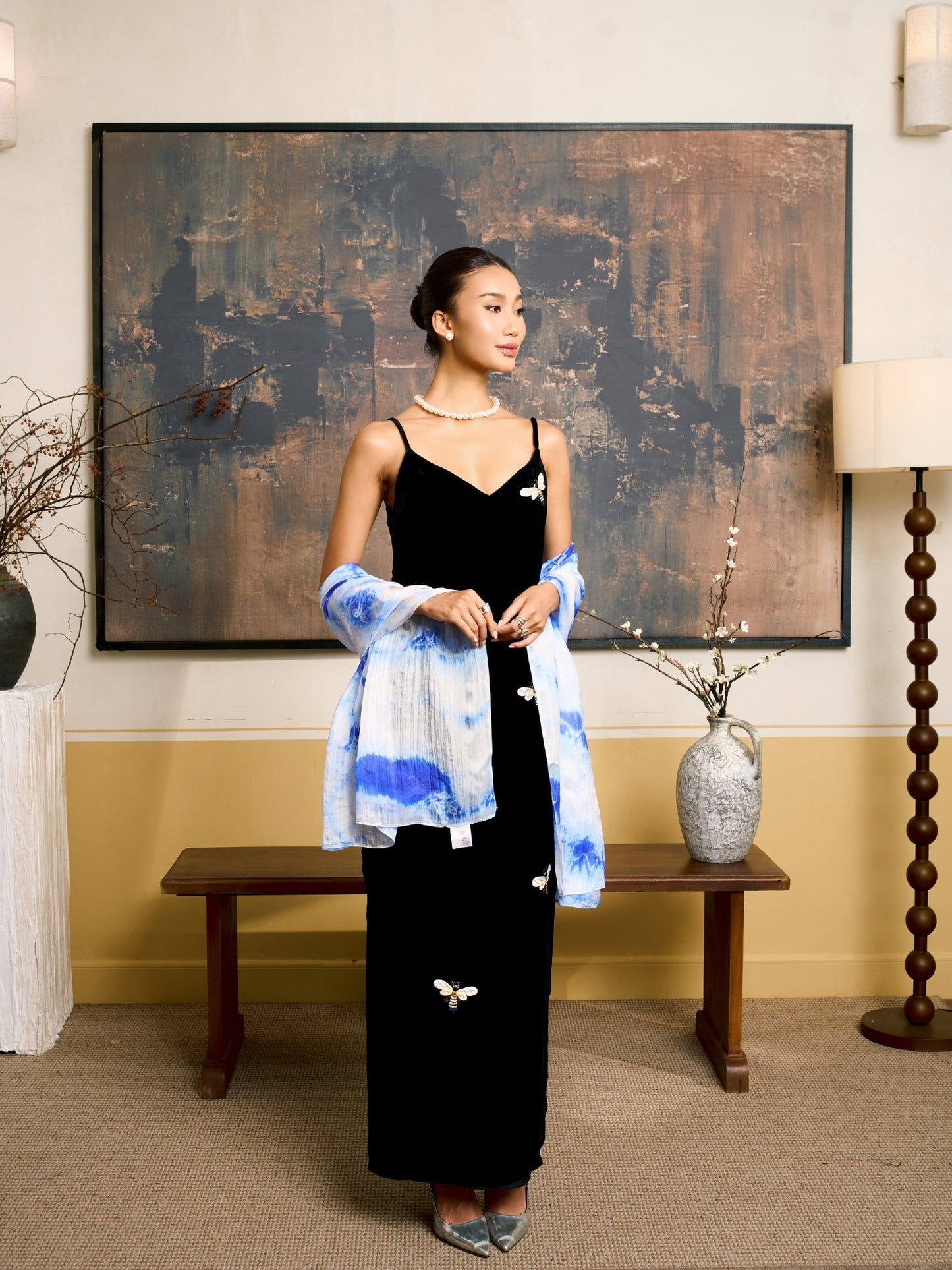 Sky blue shibori mulberry silk scarf styled loosely around the neck